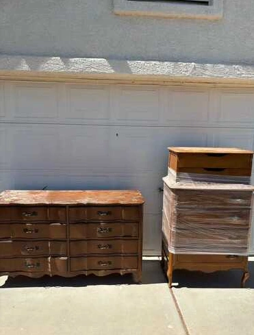 Wooden furniture beside a residential garage