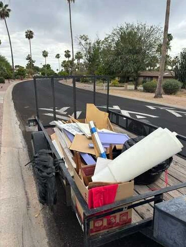 Hauling trailer loaded with furniture and household items
