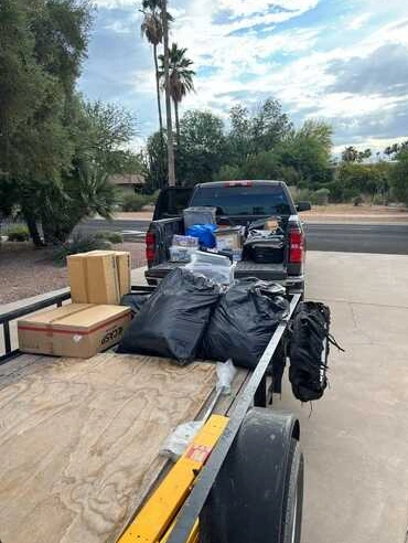 Household items loaded on a junk hauling trailer