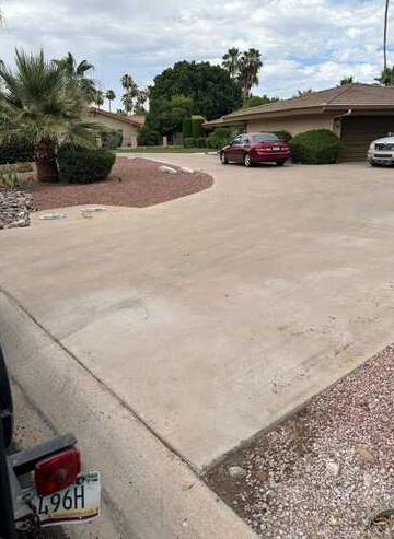 Clear residential driveway with Arizona desert landscaping